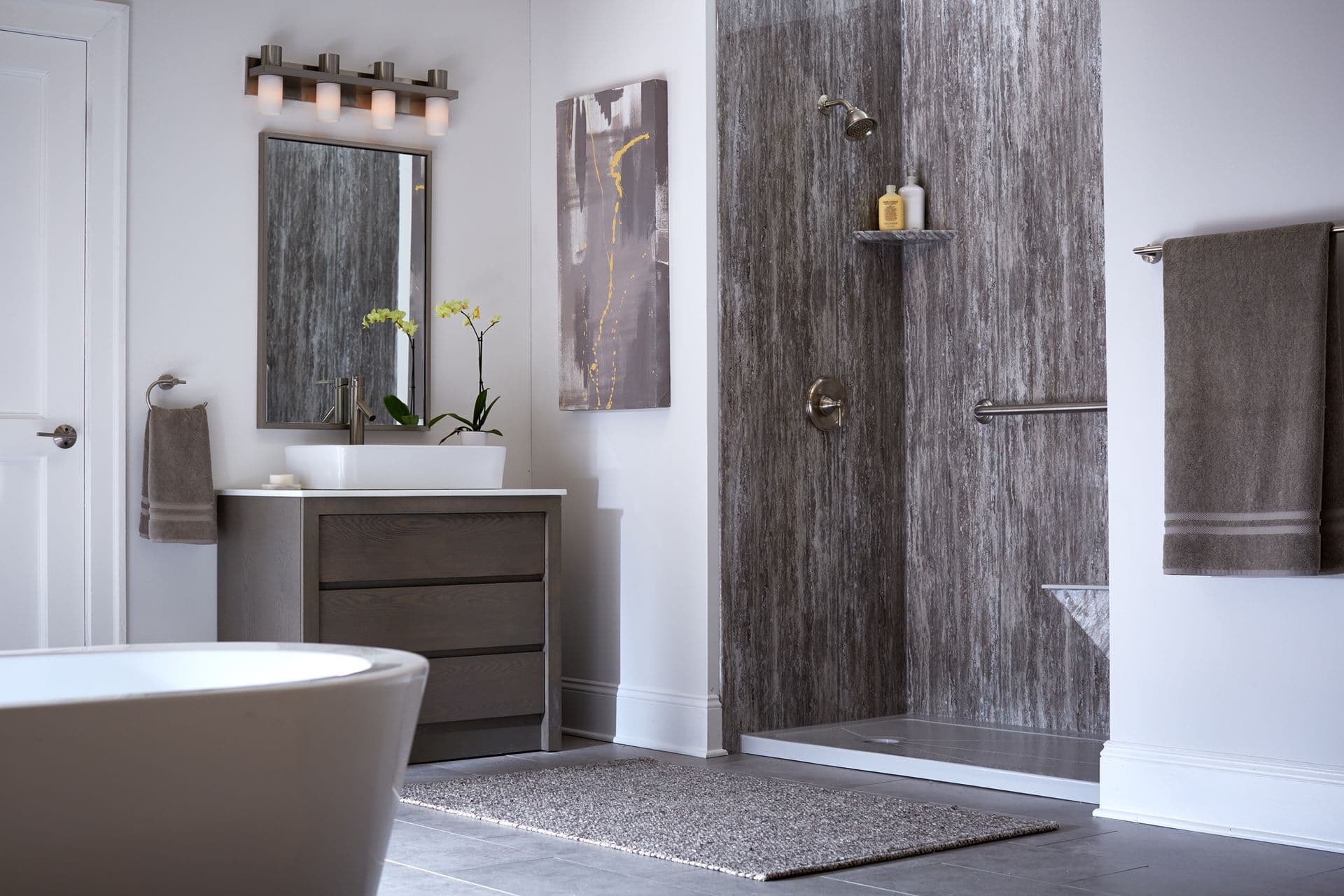 A photo of a bathroom with sink and vanity, soaking tub off to the left, and an Easy Step Marble Cove shower