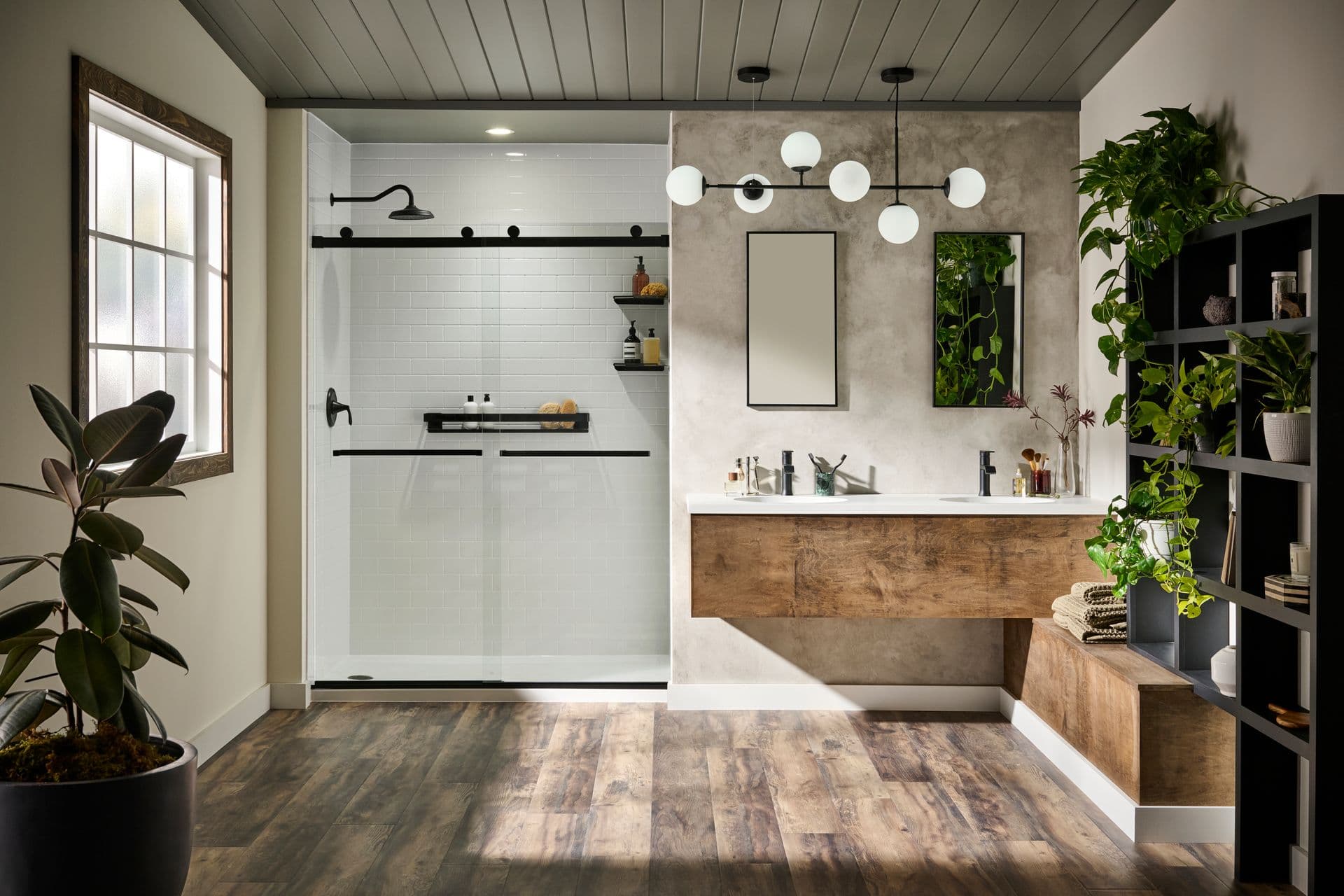 A photo of a BathWraps Formed Subway Tile Walls Aspirational Couple shower with sliding doors and black fixtures. A wooden double vanity is off to the right.